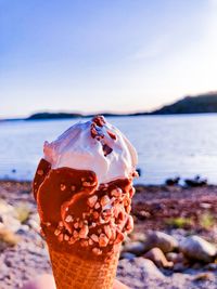 Close-up of ice cream on beach