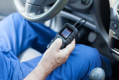 Close-up of man using mobile phone