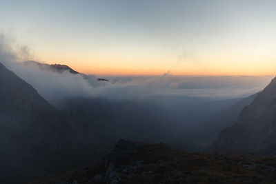 Scenic view of mountains against sky during sunset