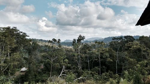 Scenic view of mountains against cloudy sky