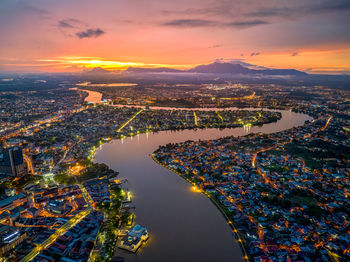 High angle view of illuminated cityscape against sky during sunset ii kuching - sarawak