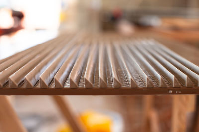 Close-up of metal grate on table