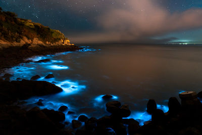 Scenic view of sea against sky at night