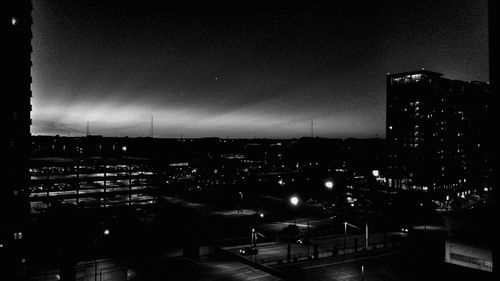 Illuminated buildings in city at night
