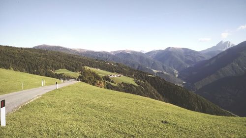 Surface level of countryside landscape against clear sky