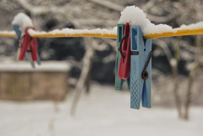 Close-up of clothespins on clothesline