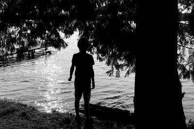 Full length of woman standing in water