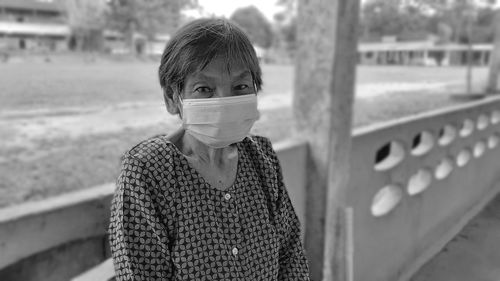 Portrait of senior woman standing outdoors