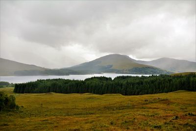 Scenic view of landscape and mountains against sky