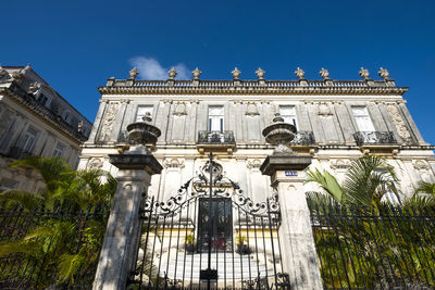 Low angle view of historical building against blue sky