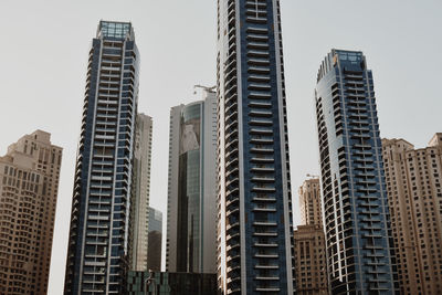 Low angle view of modern buildings against clear sky