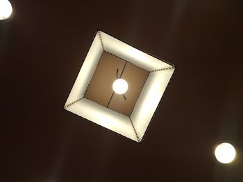 Low angle view of illuminated lamp