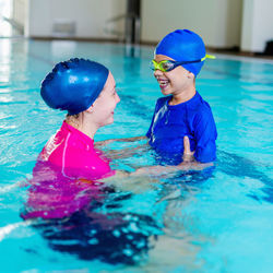 Boy swimming in pool