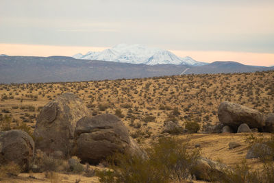 Scenic view of landscape and mountains against sky