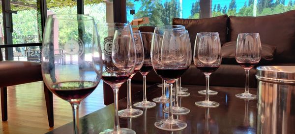 Close-up of wine glasses on table in restaurant