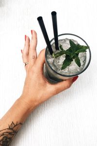 Close-up of woman hand holding drink