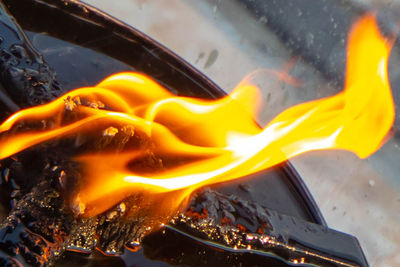 Close-up of fire on barbecue grill