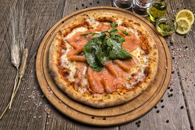 High angle view of pizza served on table