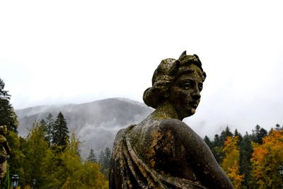 Low angle view of statue against sky