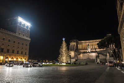 Illuminated city buildings at night