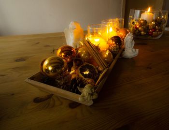 High angle view of illuminated candles on table