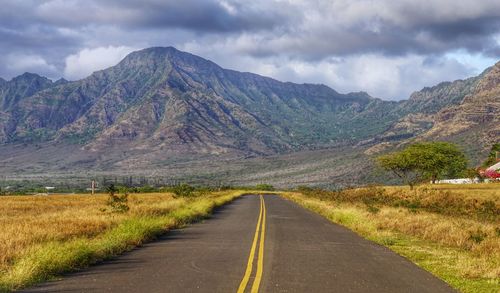 Country road leading towards mountains