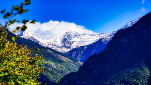 Scenic view of snowcapped mountains against sky