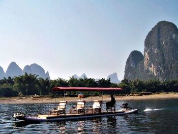 Scenic view of boat in sea against clear sky