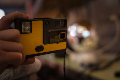 Male hand and old vintage camera