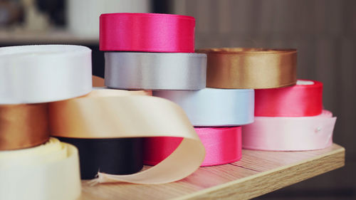 Gift wrapping ribbons. multicolored silk ribbons, ribbon reels for packaging, gift decoration.