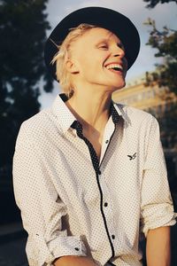 Smiling young woman looking away outdoors