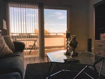 Electric lamp on table by window at home