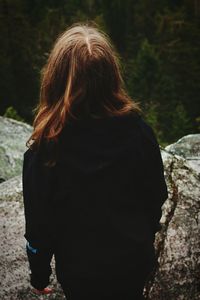 Woman standing on rock