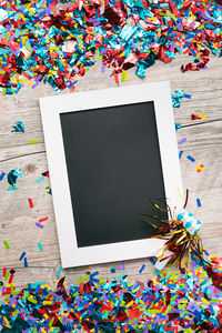 High angle view of multi colored paper on table