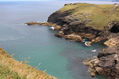 High angle view of rocks on sea shore