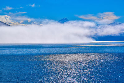 Scenic view of sea against blue sky