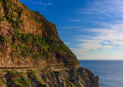 South africa,cape town,chapmans peak drive panorama,impressive mountains,road,blue sky and sea