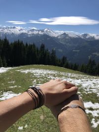 Midsection of woman against mountain range