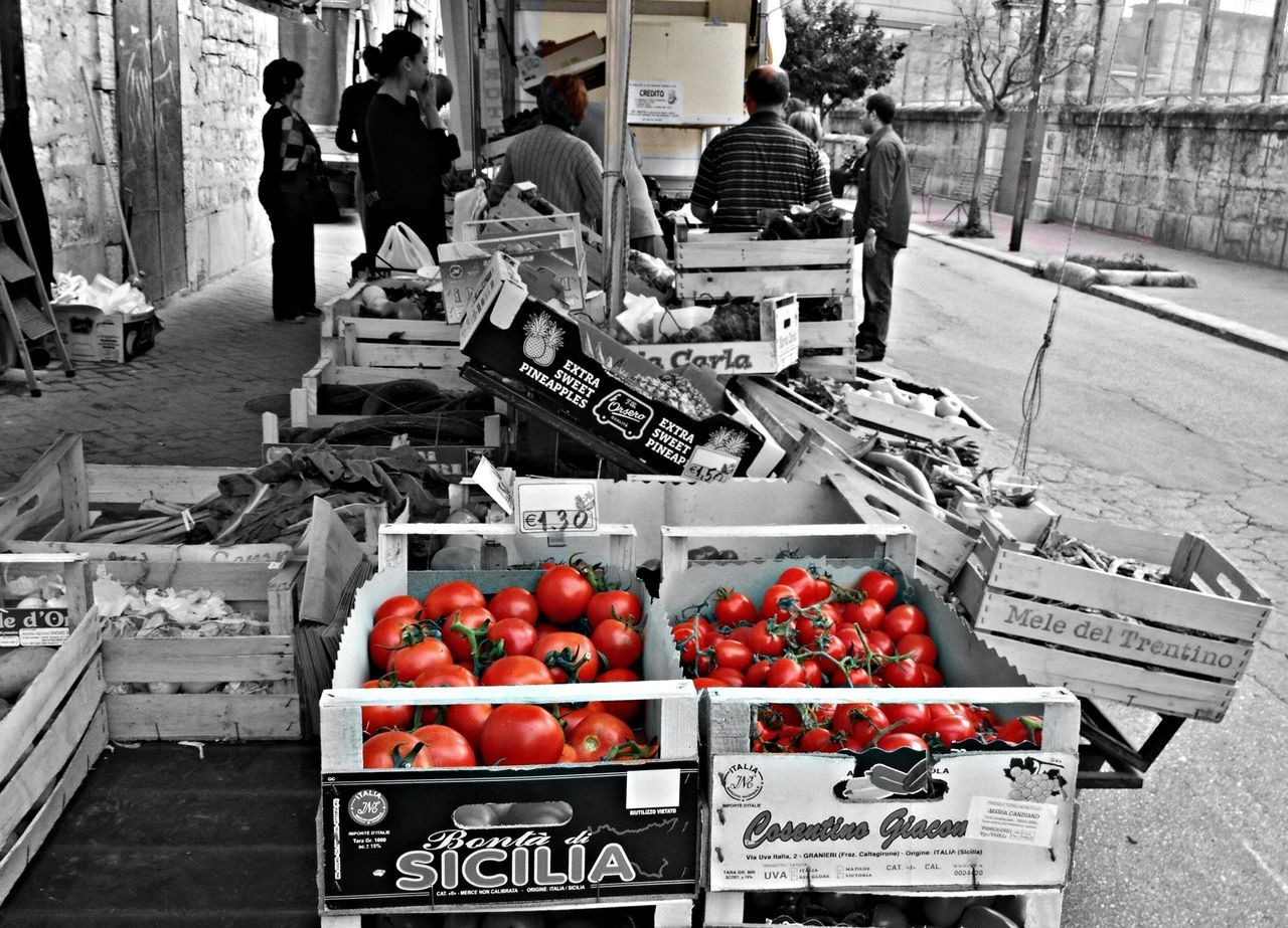 food and drink, food, market, retail, healthy eating, market stall, freshness, fruit, for sale, street, incidental people, men, building exterior, red, large group of objects, person, abundance, day, city