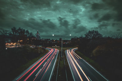 High angle view of light trails on road at night