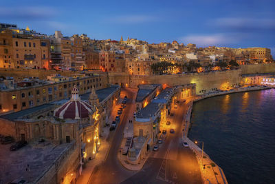 High angle view of river amidst buildings in city