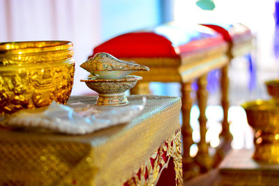 Close-up of cross on table