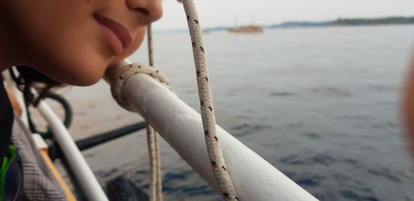 Close-up of man eating at beach