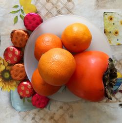High angle view of orange fruits on table