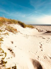 Scenic view of beach against sky