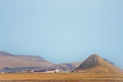 Scenic view of landscape against clear blue sky