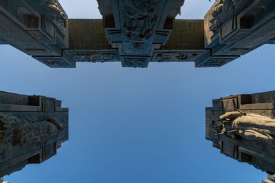 Low angle view of buildings against clear sky