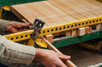 Carpentry workshop. composition of wooden products in woodworking workshop. hands of master