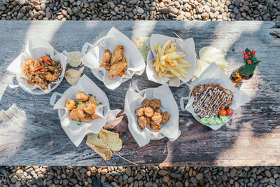 Outdoor party food table with fried food dishes