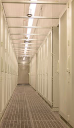 Cold aisle and front view of server racks in a data center